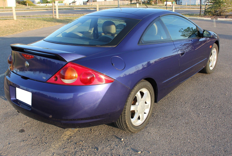 Illustration for article titled For $5,000, Is This Low-Mileage 1999 Mercury Cougar V6 The Cat’s Meow?